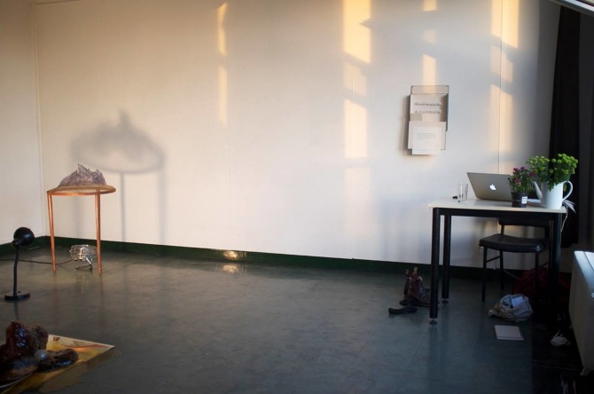Inside the studio of 2013 Cité resident, Gabriella Hirst. It is a sparse room with a small desk.