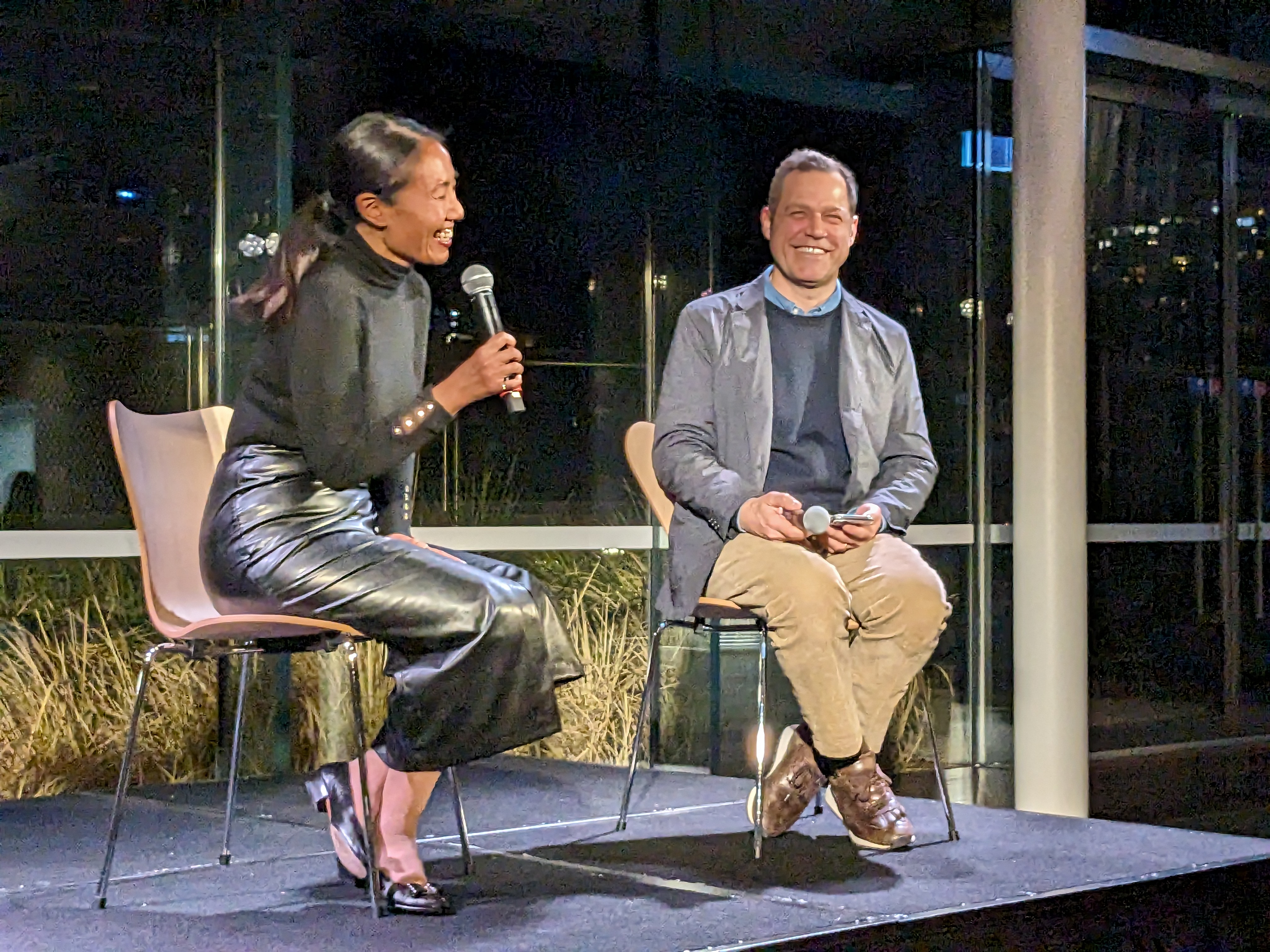 Melody Rod-ari and Olivier Krischer sit on a stage in conversation